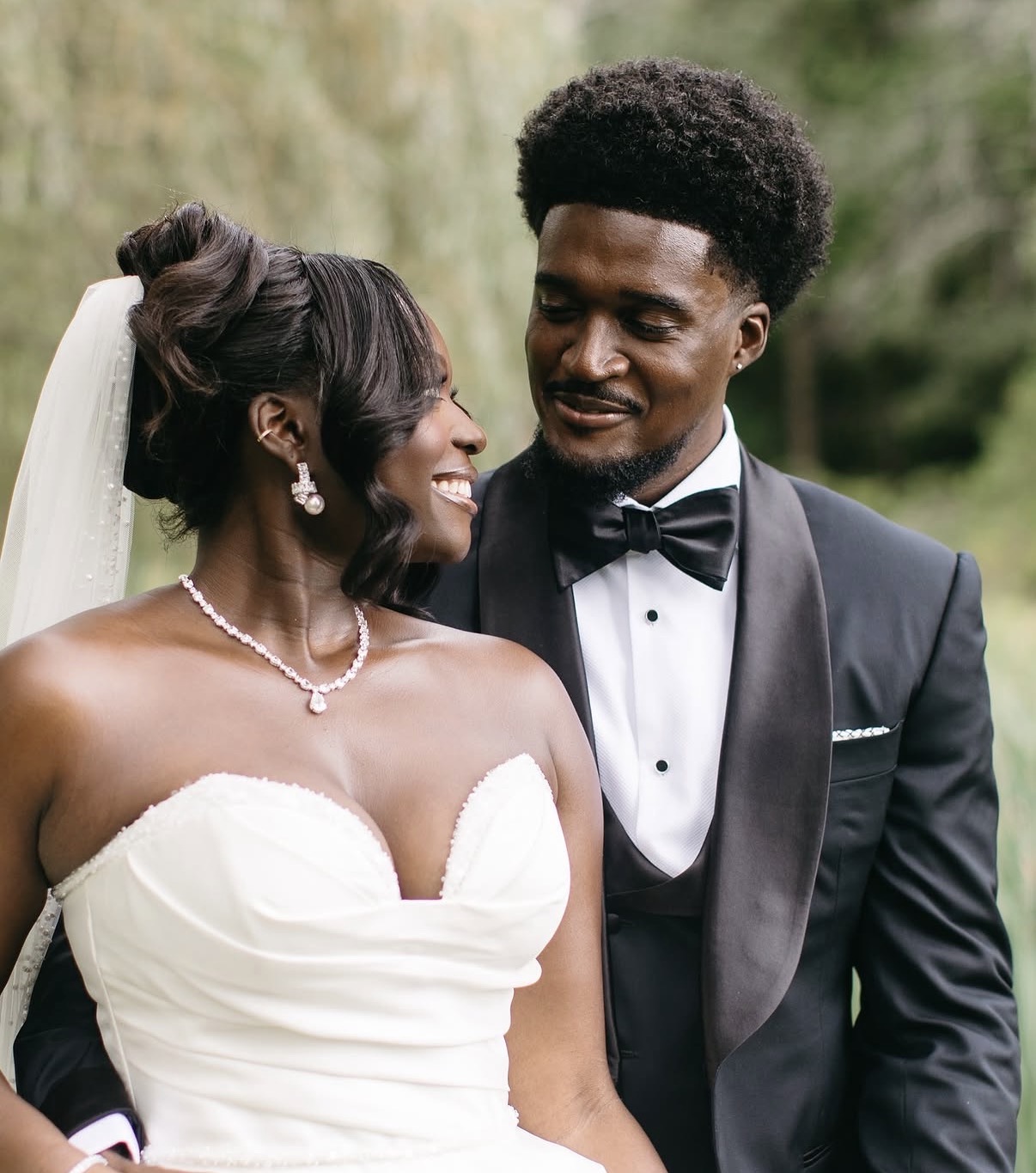Bride and groom sharing a joyful moment on their wedding day